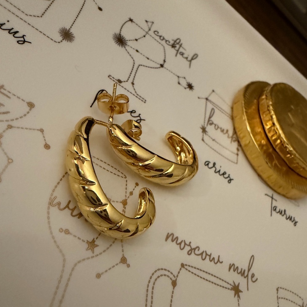 Gold twisted croissant half hoop stud earrings